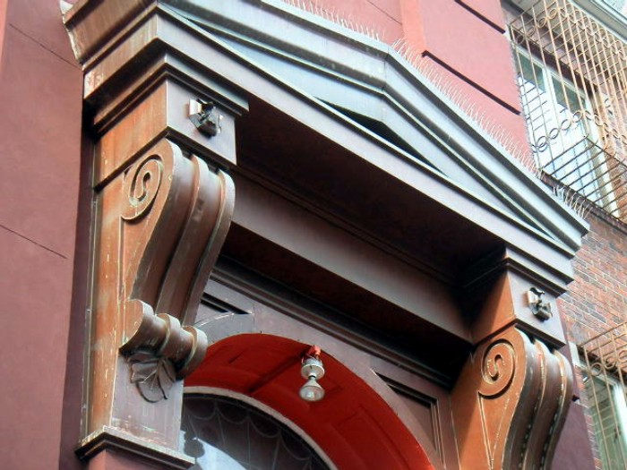 Photo: NYC-architecture. Note pressed metal brackets and pediment.