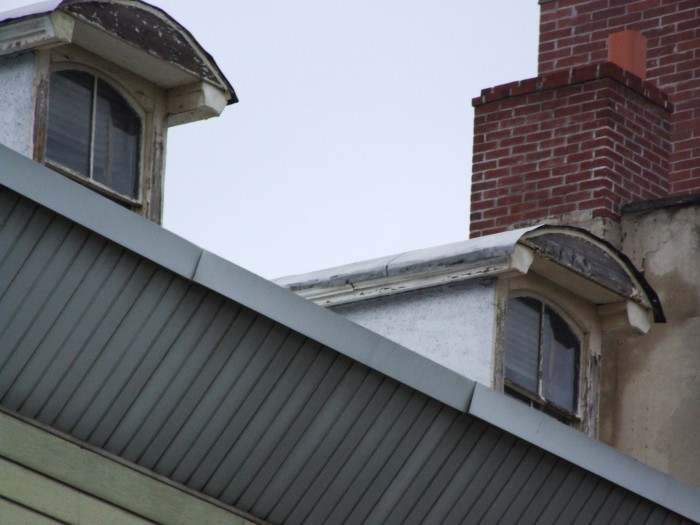 There's probably a perfectly good cornice under the siding.
