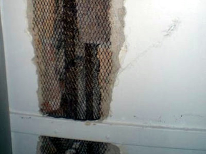 Using metal mesh as repair lath. Plaster scratchcoat is then troweled onto the mesh. Photo: homerepair.gregvan.com