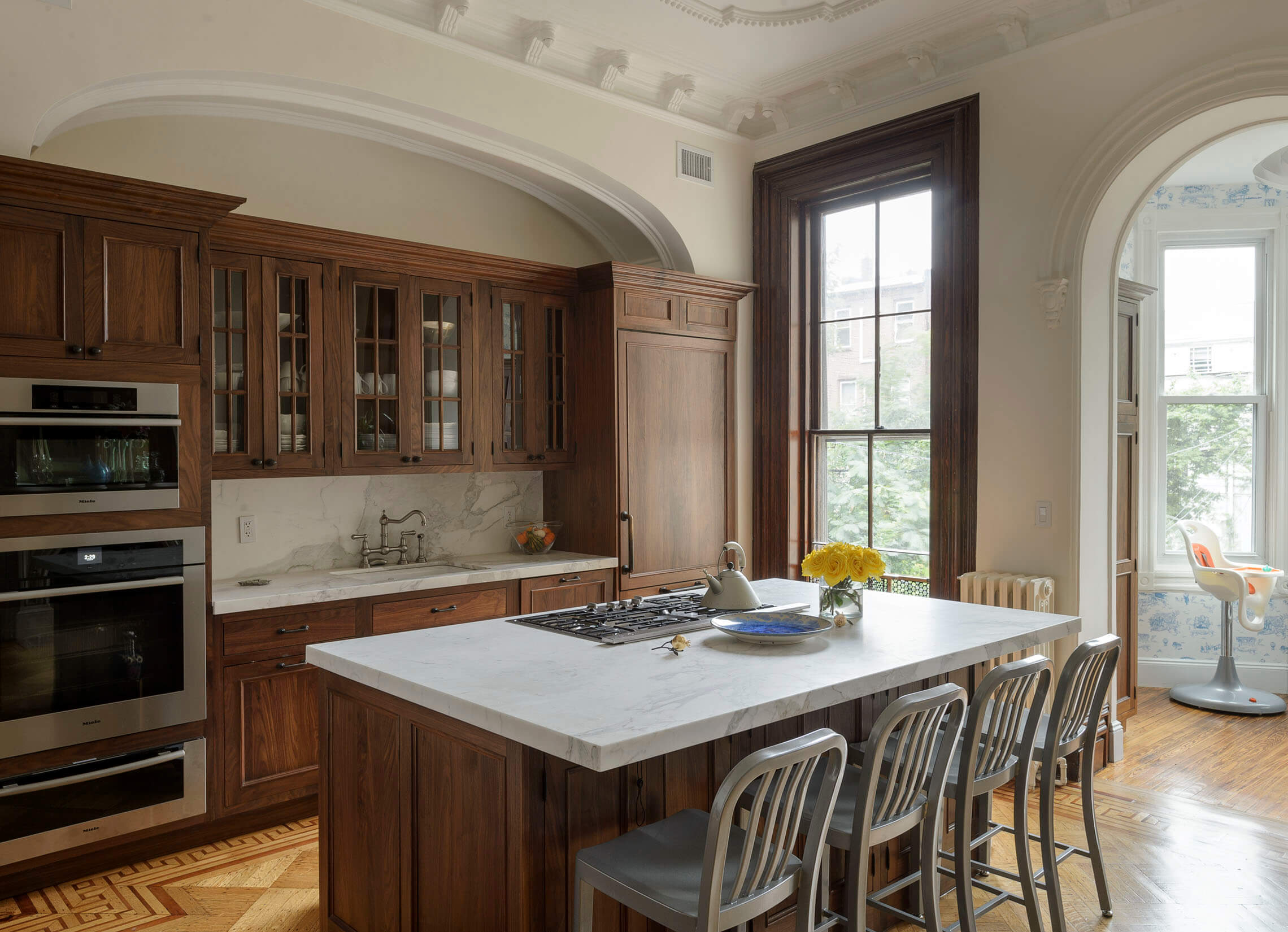 A mishap with the measuring of the kitchen island would have cost thousands to correct, so they flipped the layout of appliances to make the stone fit