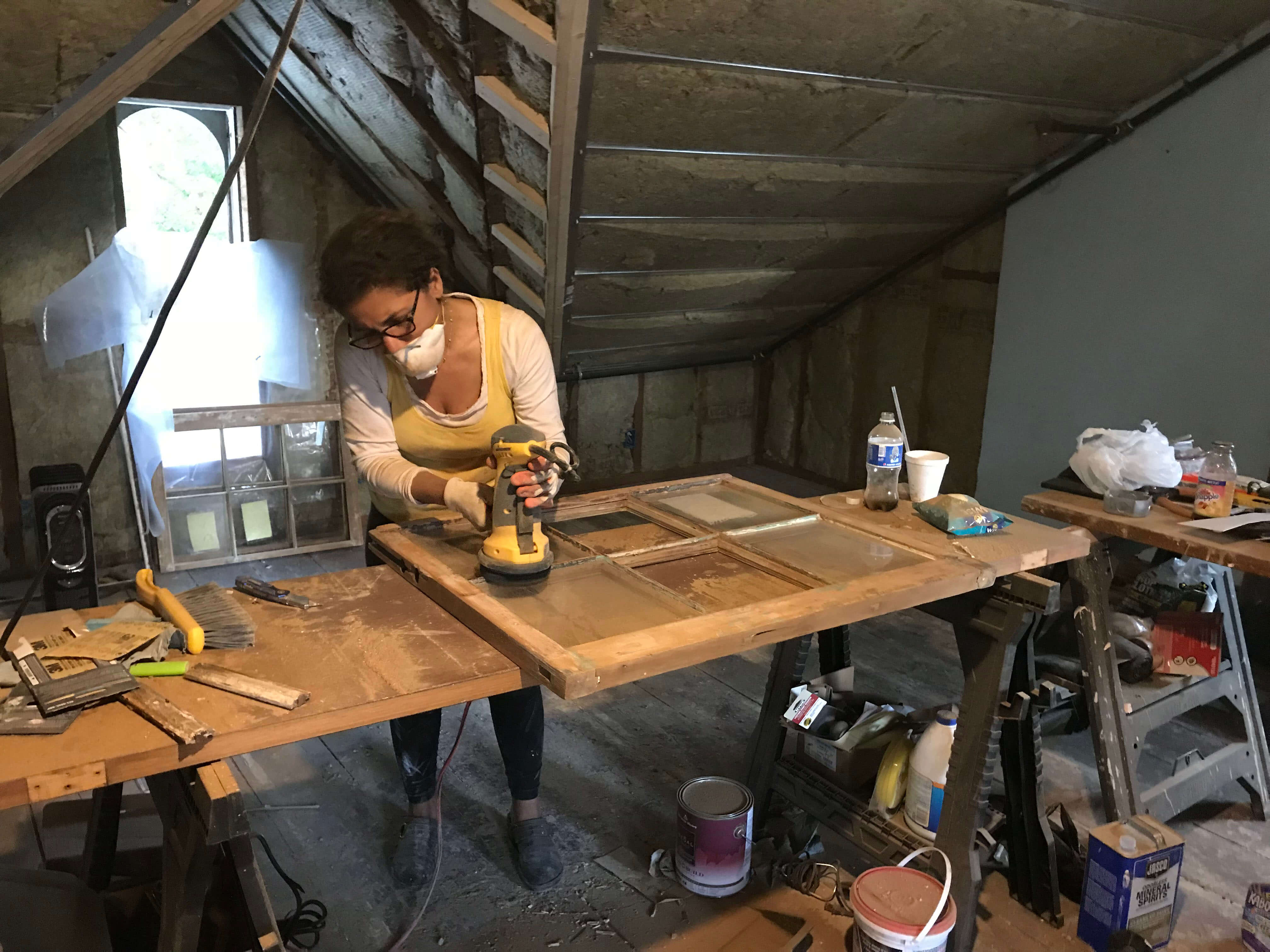 Elizabeth Vega-Lebron restoring the original windows of her home 