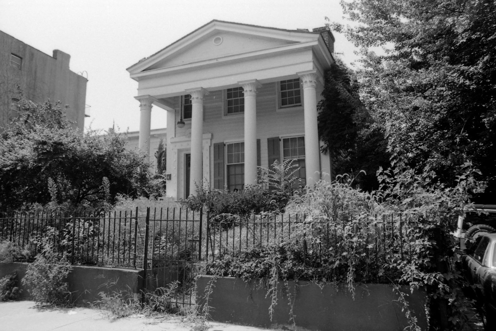 clinton hill - black and white photo of a temple front Greek Revival
