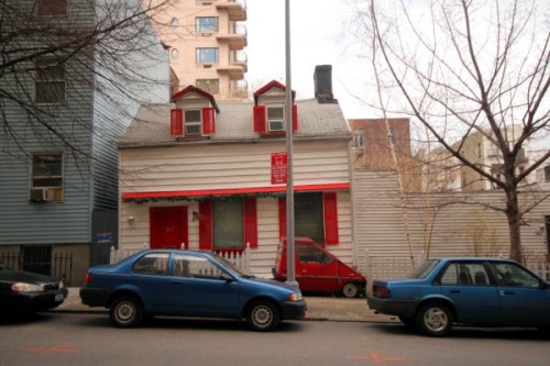 small house with red trim