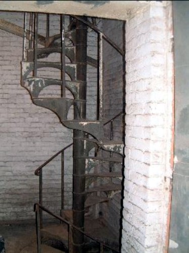 Spiral staircase that spans all six floors. Photo: National Register report. nps.gov