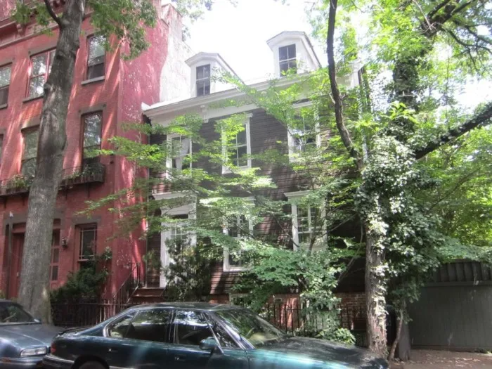 wood frame house with two dormers