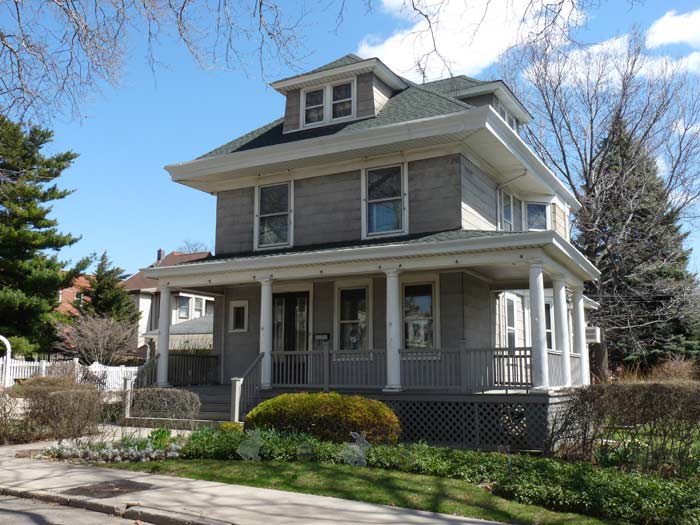 freestanding house with a wraparound porch