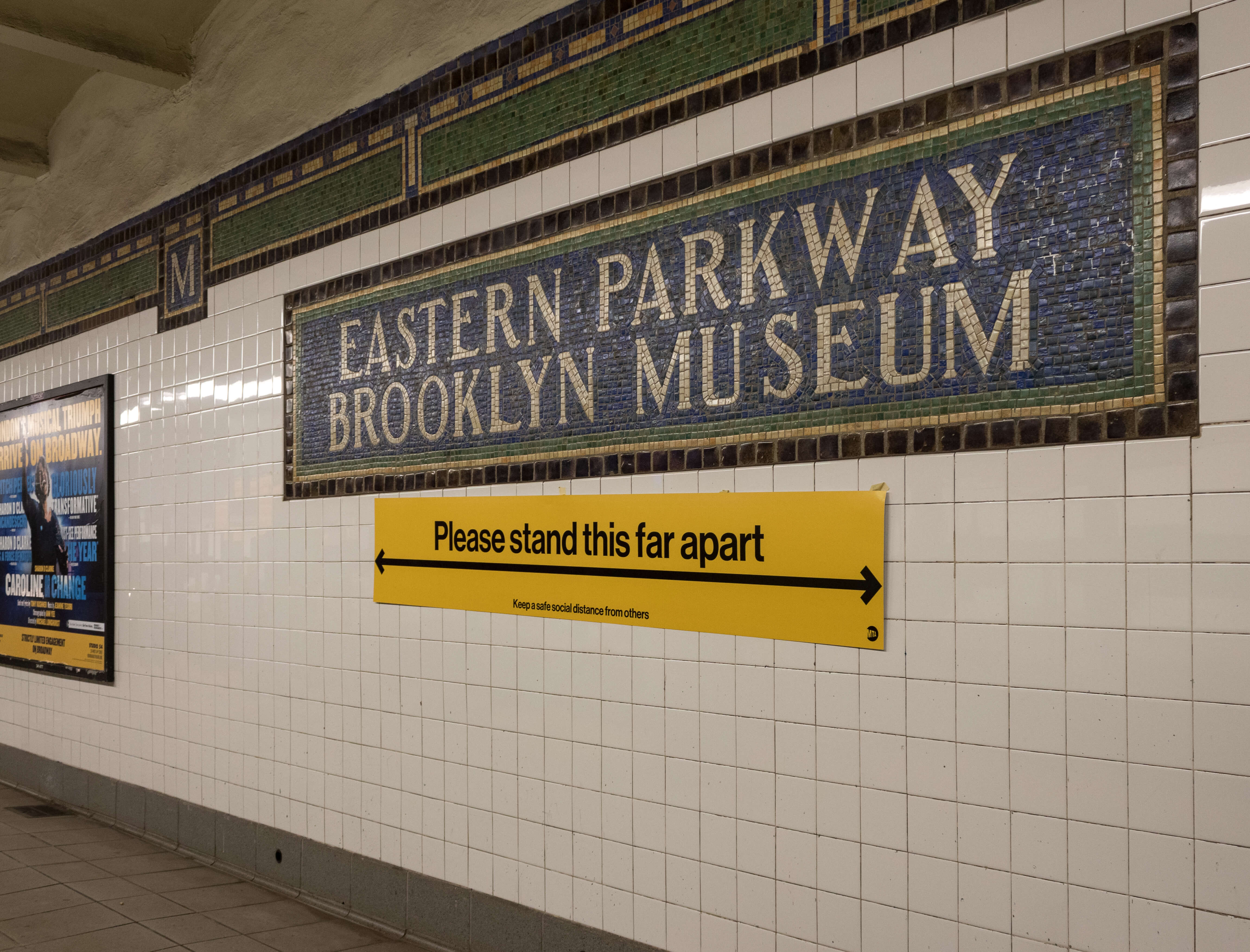 eastern parkway subway station with covid sign