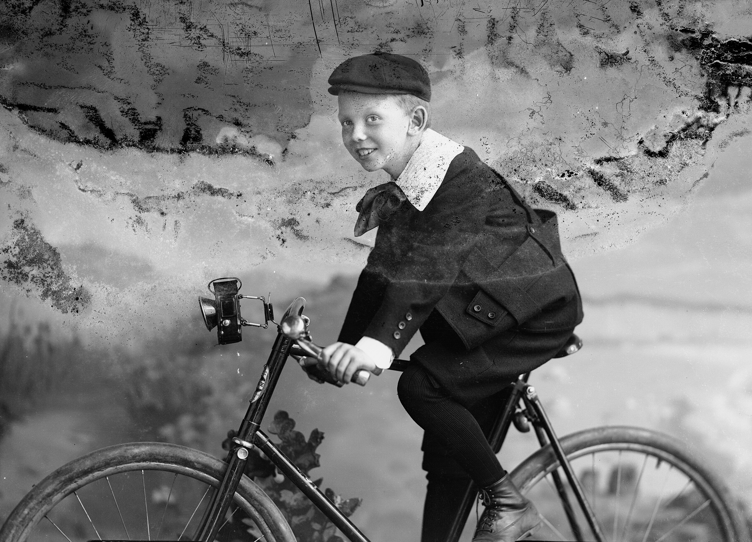 boy on a bike in the late 19th century