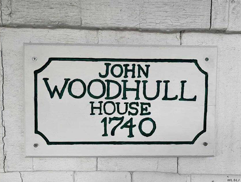 plaque on the exterior of the woodhull house