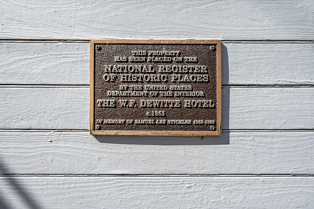 plaque on the exterior of dewitt hotel