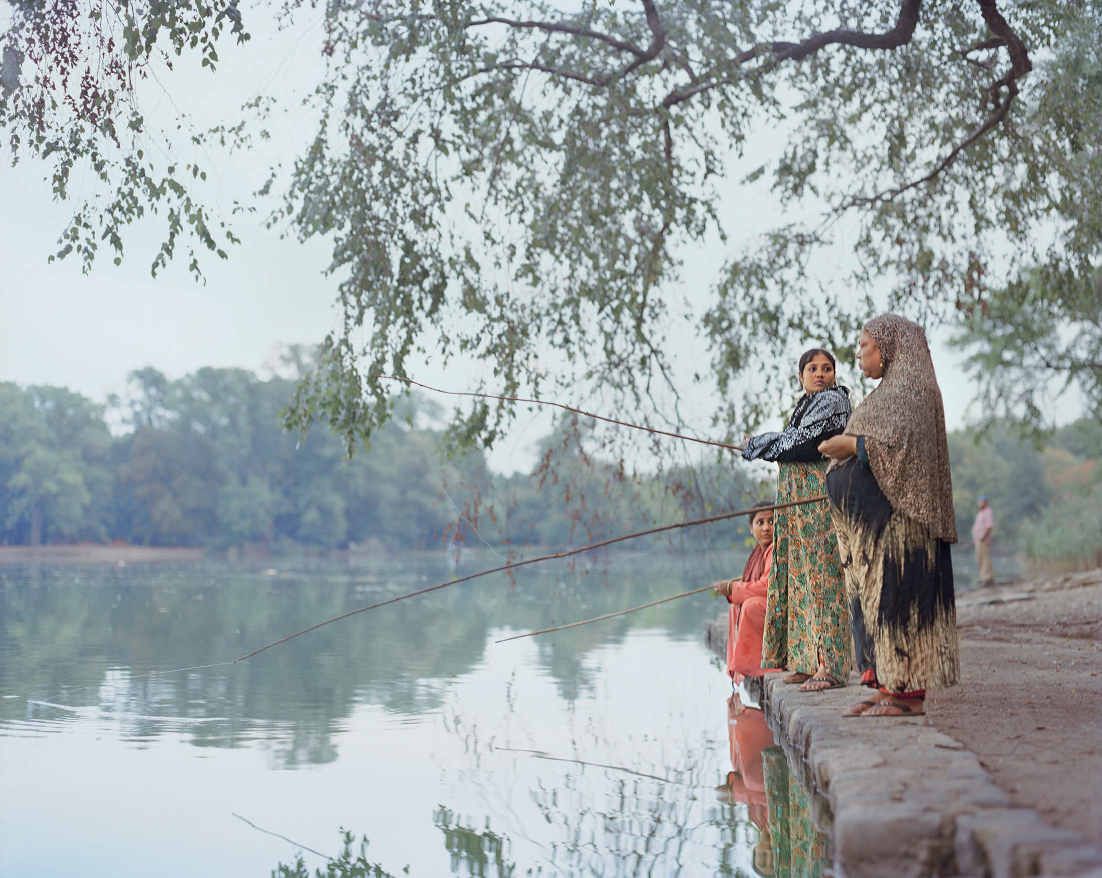 woman and children fishing