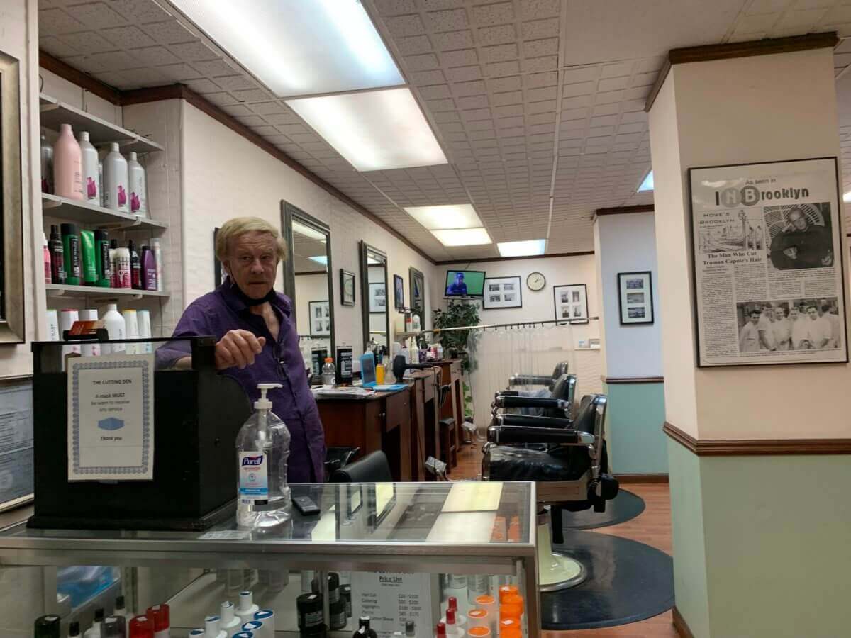 business owner inside his barbershop