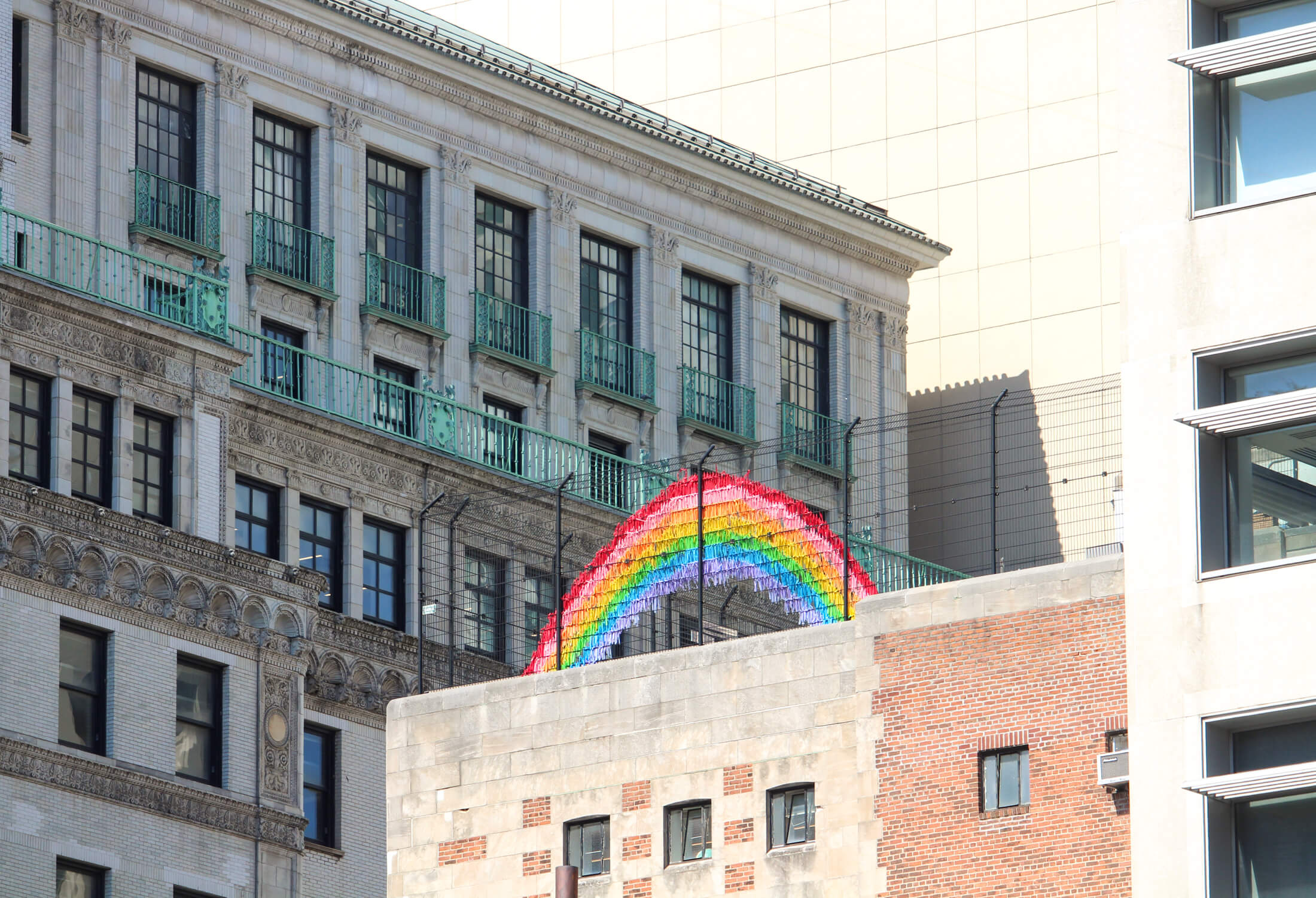 rainbow on a fence in downtown brooklyn