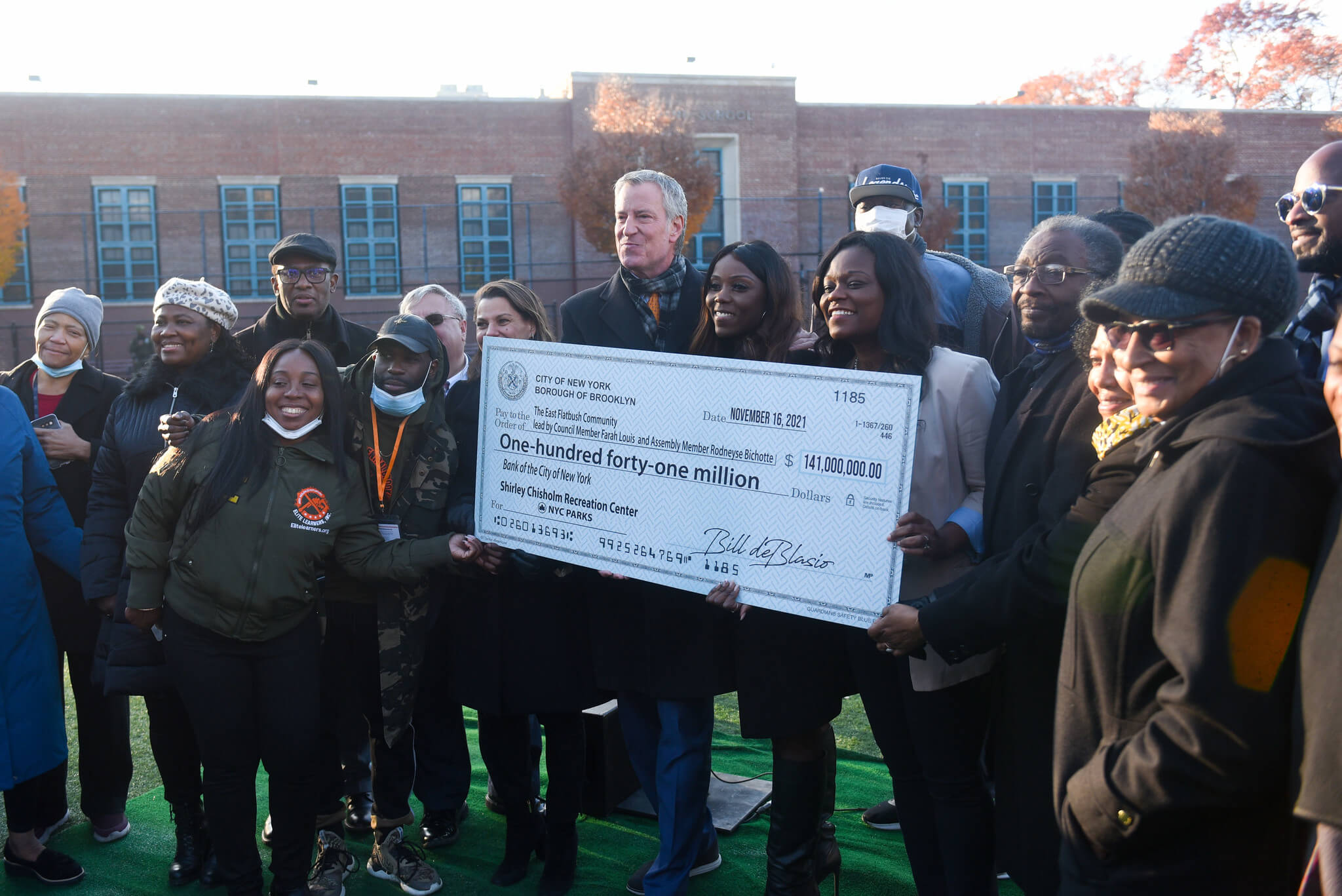 people holding giant check