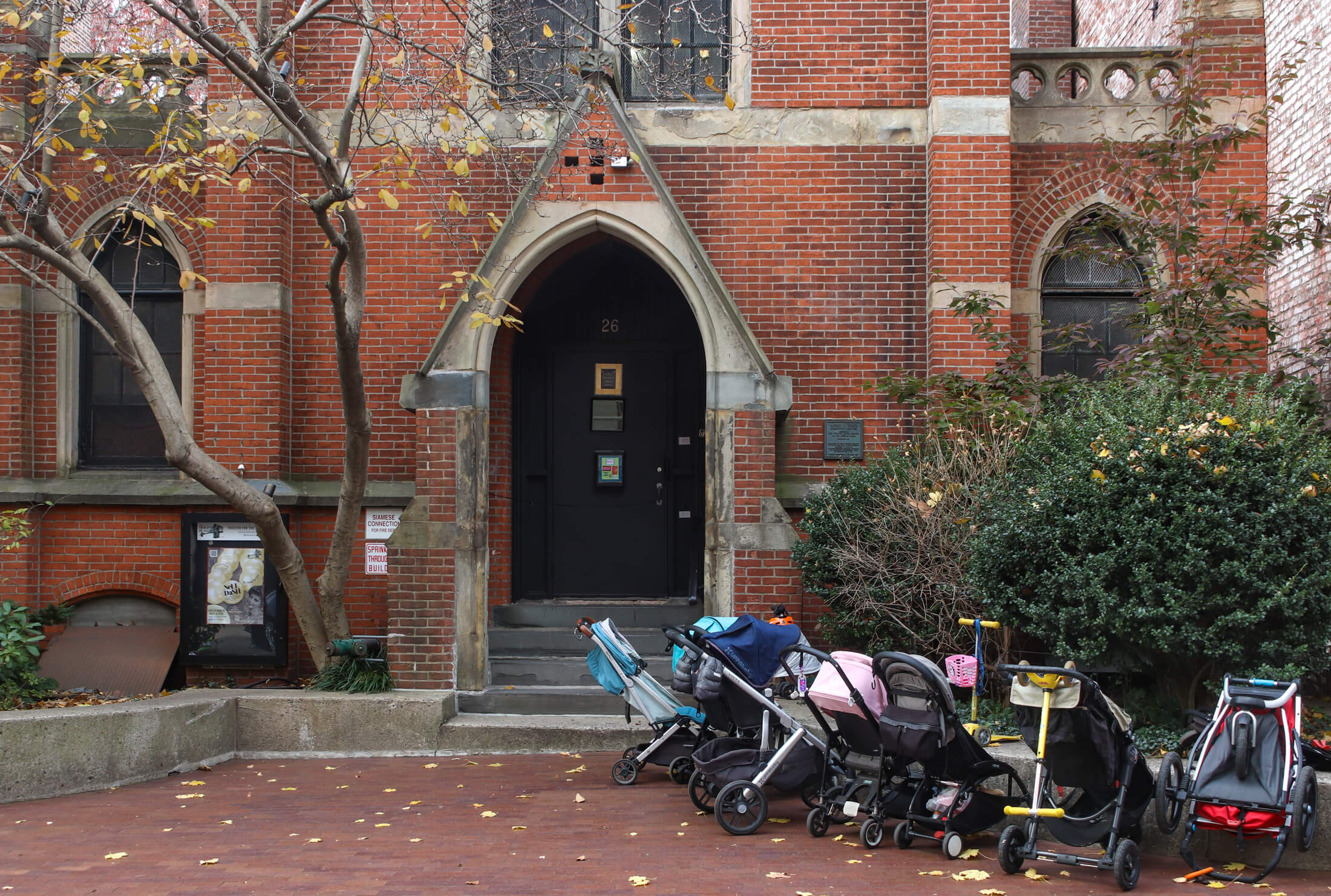 strollers outside a church