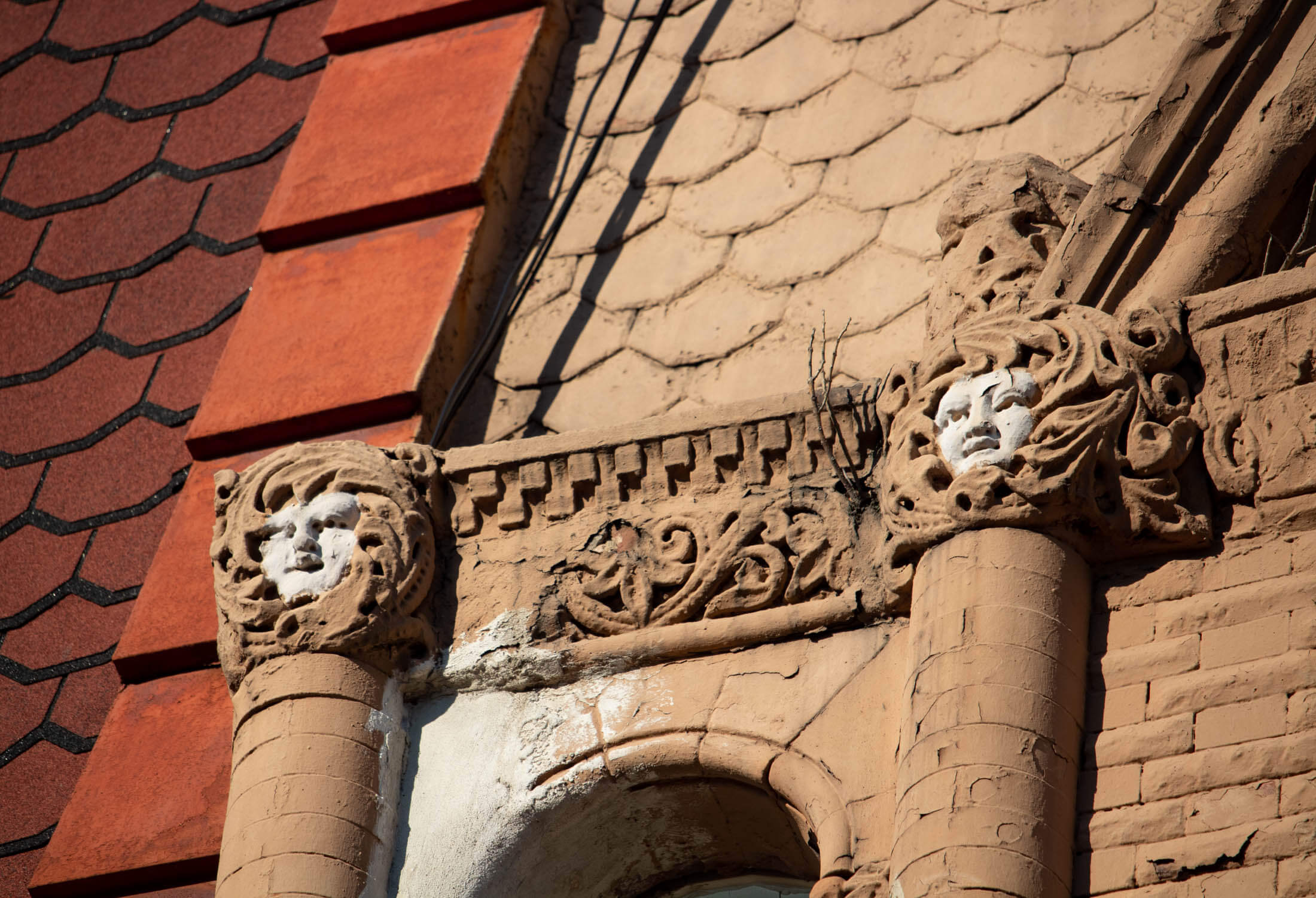faces on a building on herkimer street