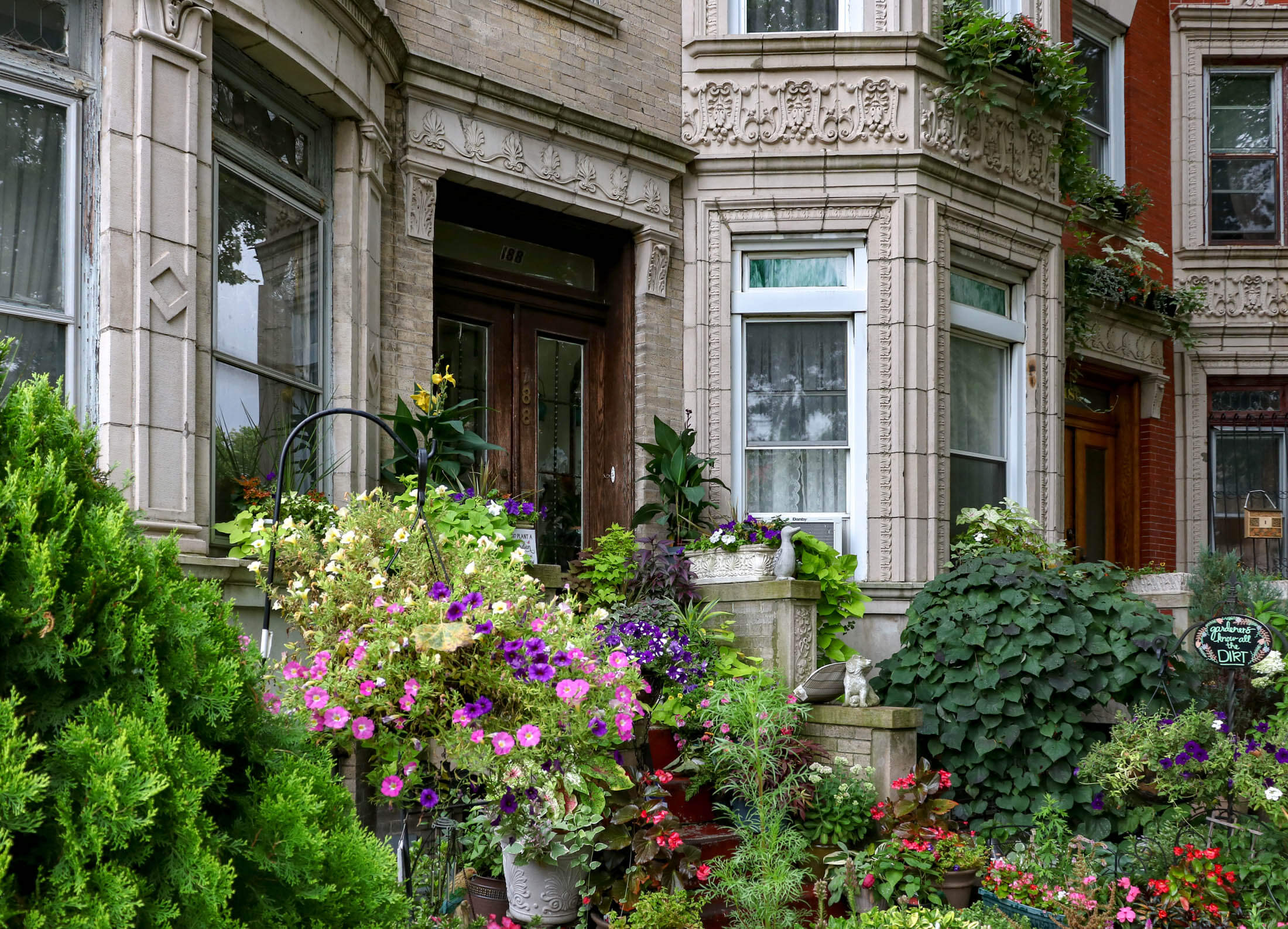 a stoop and flowers and plants