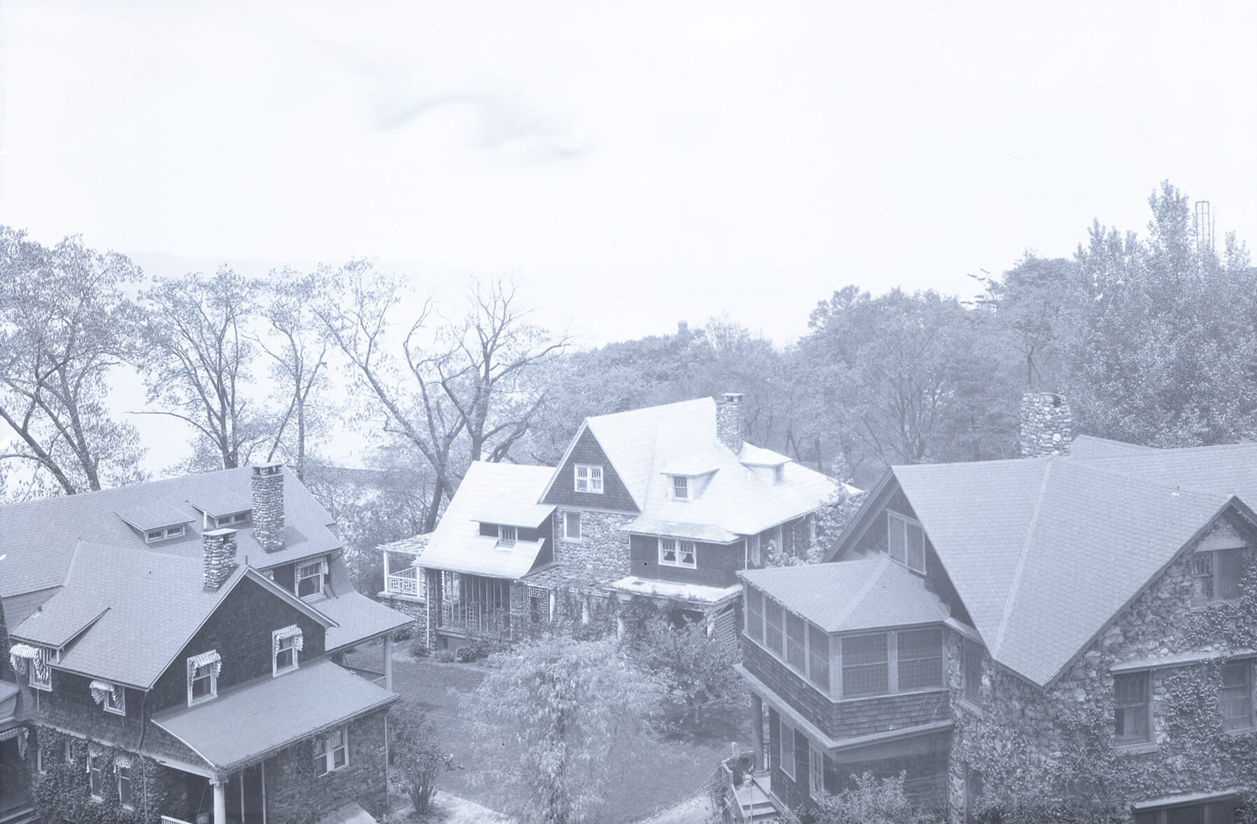 historic black and white photo of the houses of ogden park