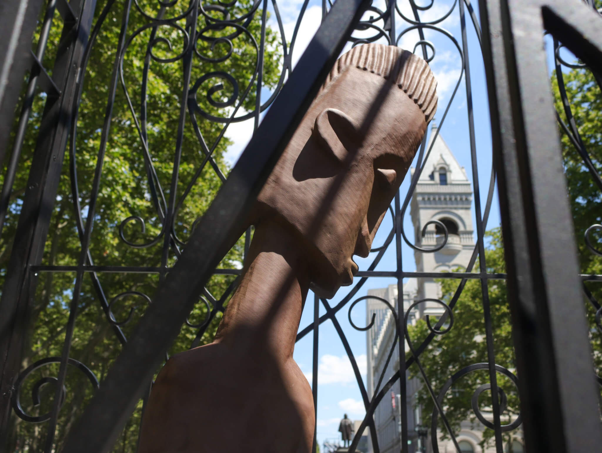 closeup of the sculpture with the post office in the background