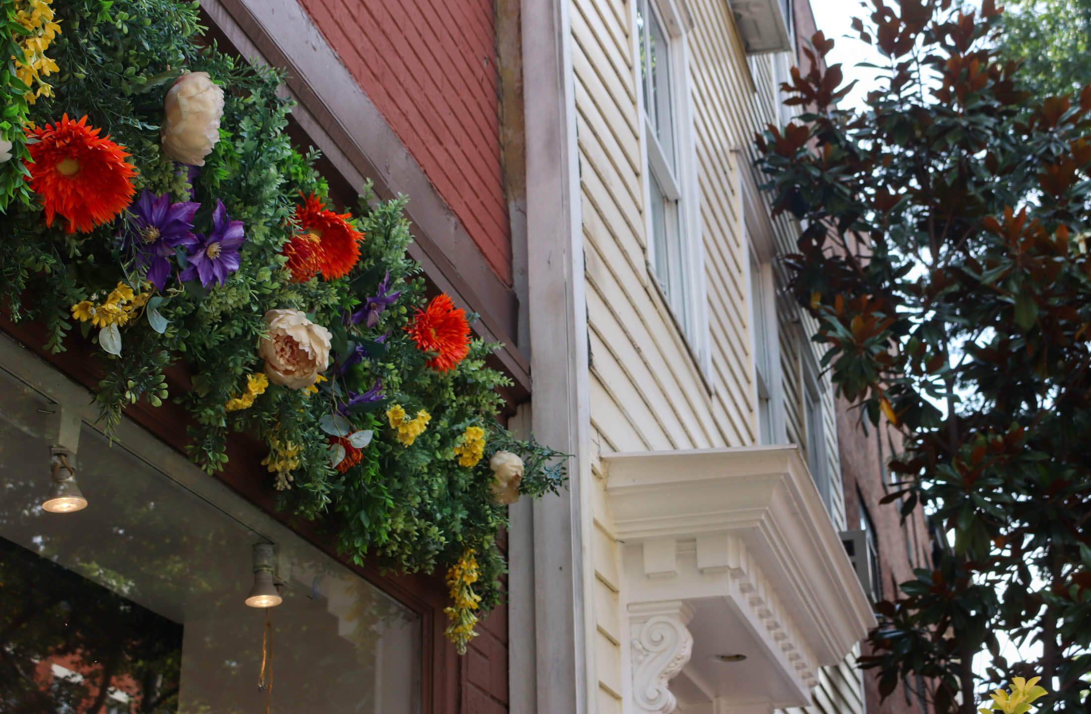 fake flowers on storefront