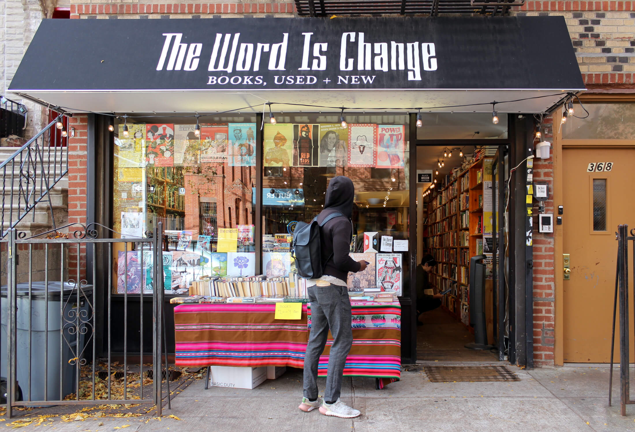 exterior of word is change bookstore 368 tompkins avenue