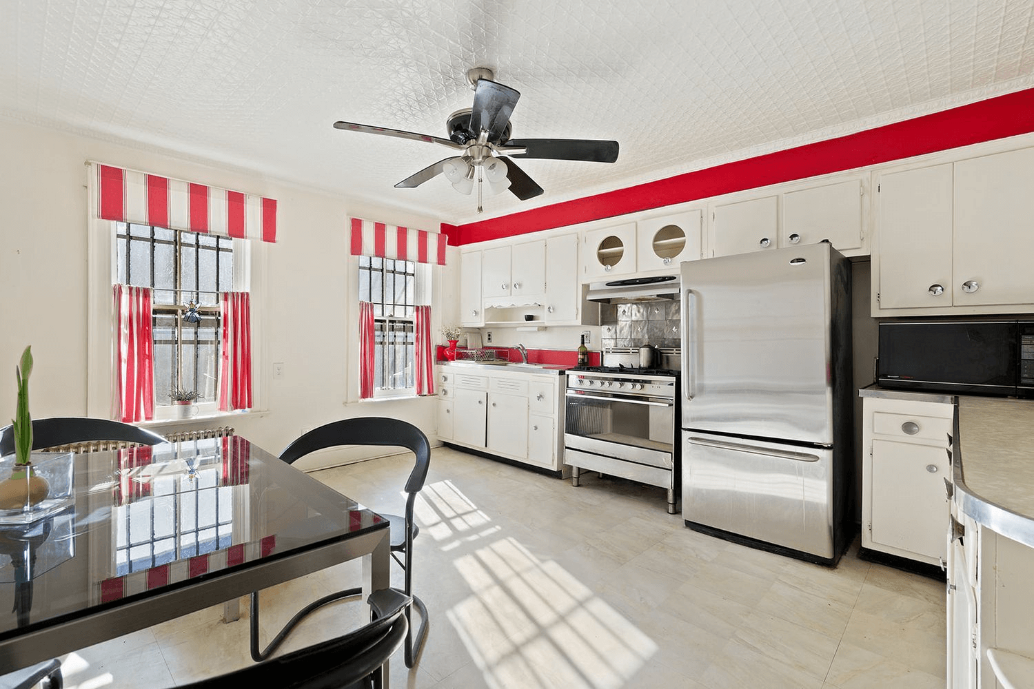 Kitchen with vintage cabinets and a tin ceiling