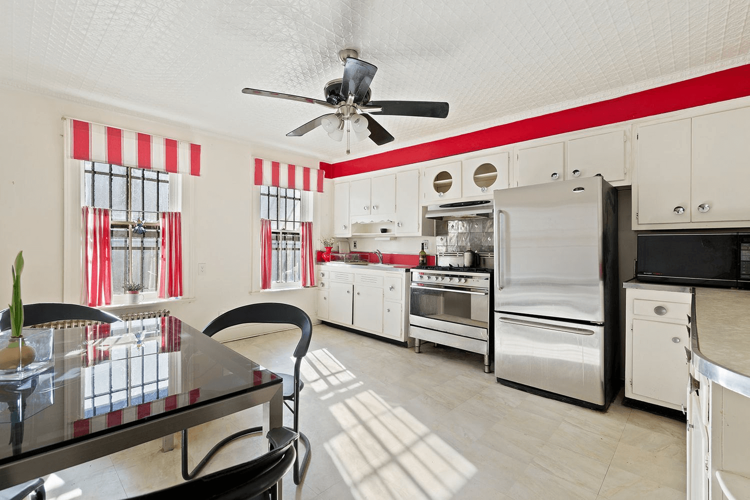 kitchen with vintage cabinets and a tin ceiling