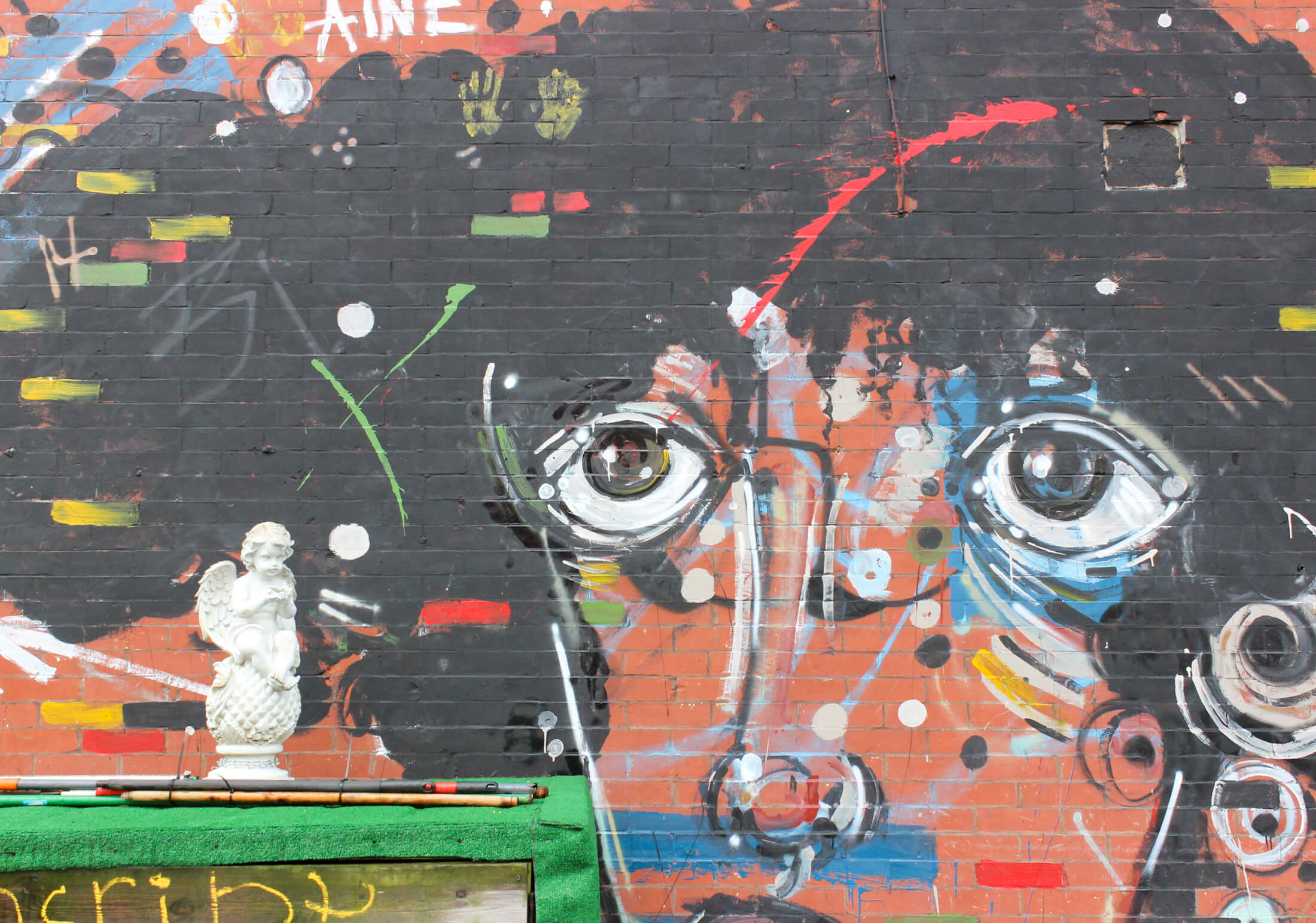 a mural painted on a brick wall in bed stuy