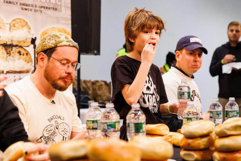 child eating a bagel