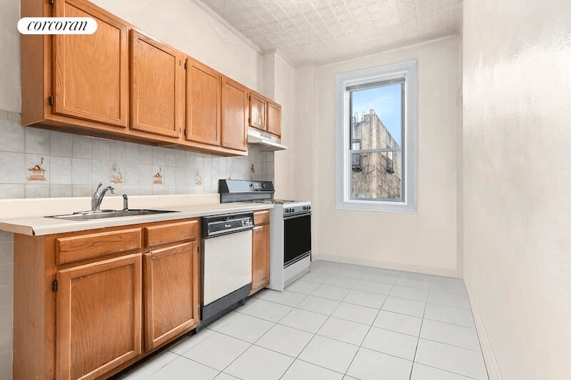 kitchen with tin ceiling and tile floor