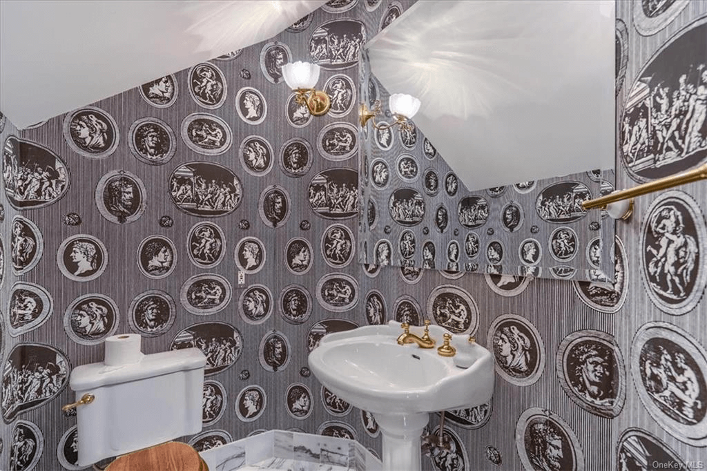 half bath with wallpapered walls on the third floor of 313 main street goshen