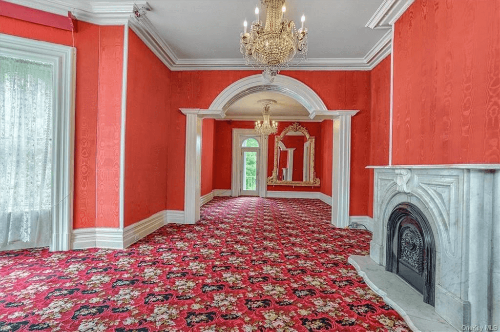 parlor with red walls and carpet in 313 main street goshen
