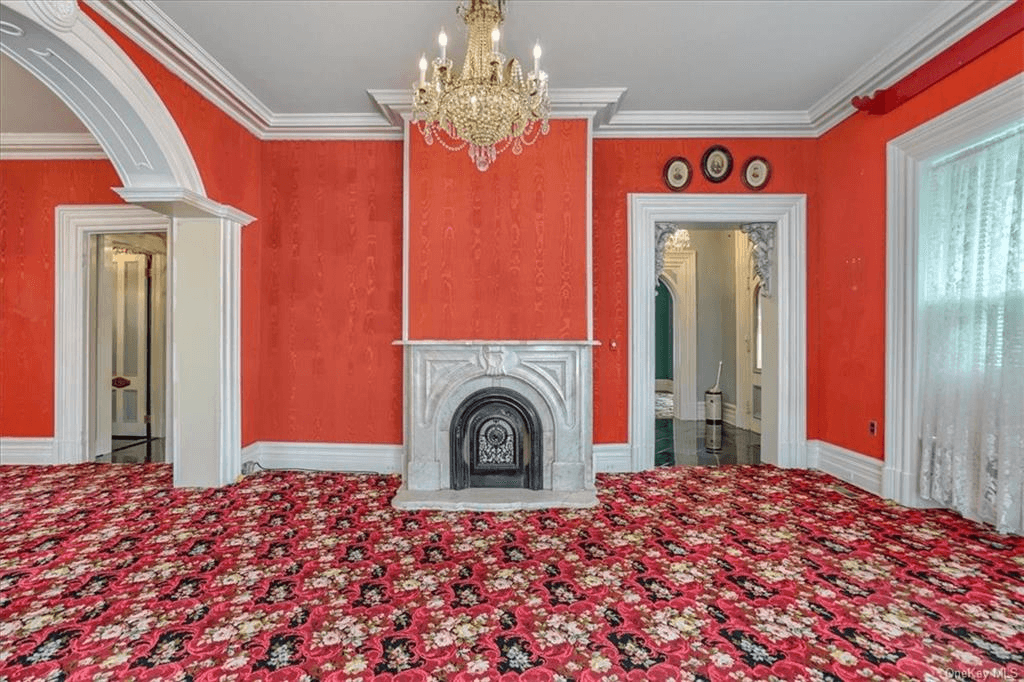 parlor with red walls and carpet in 313 main street goshen