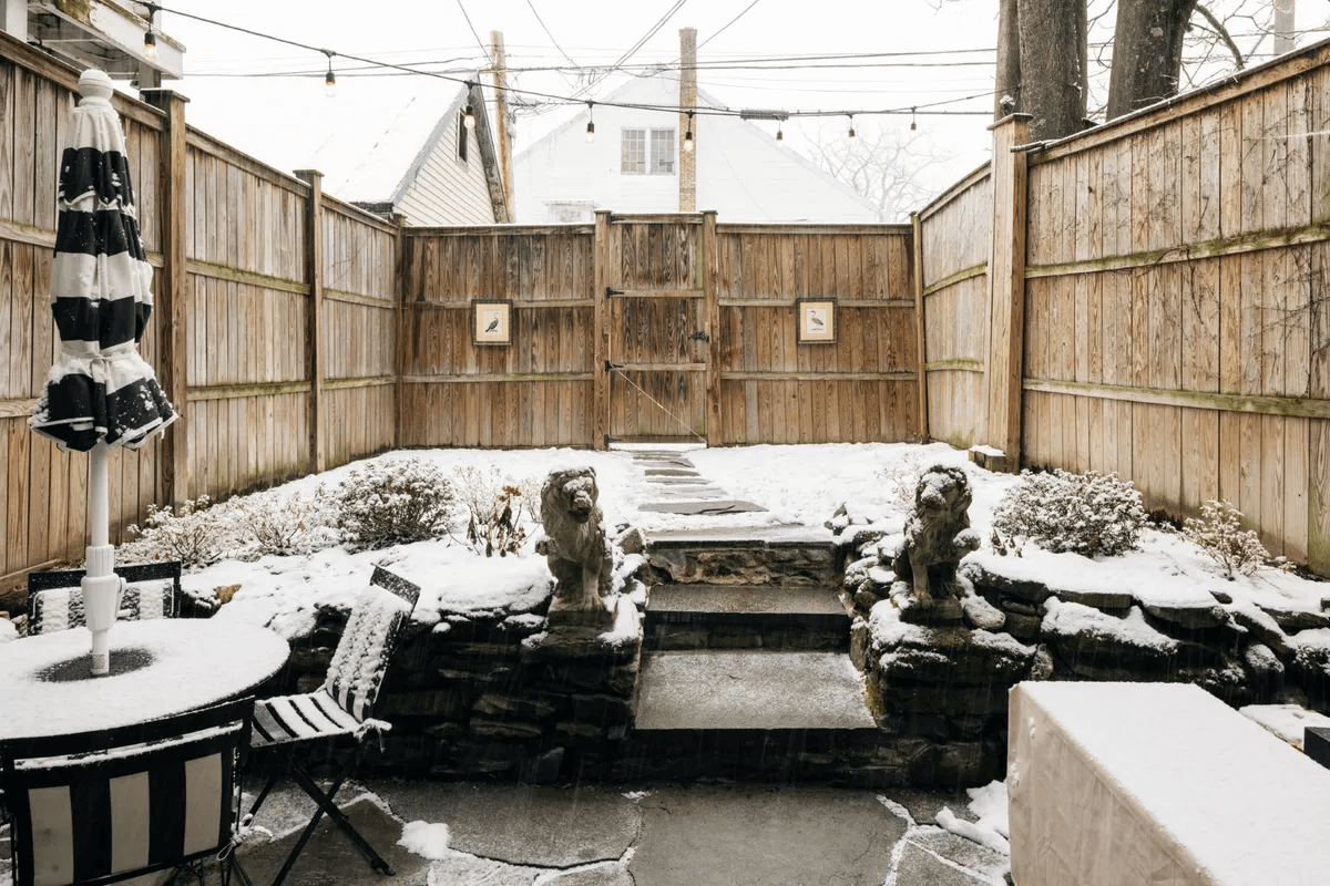 fenced in yard covered with snow