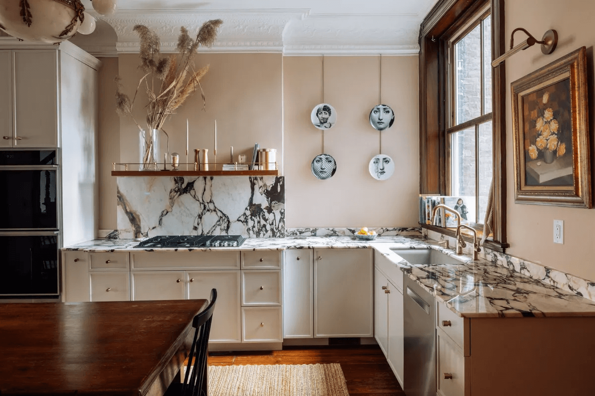 kitchen with white cabinets, marble counters