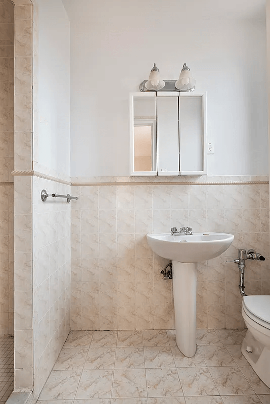 bathroom with pedestal sink