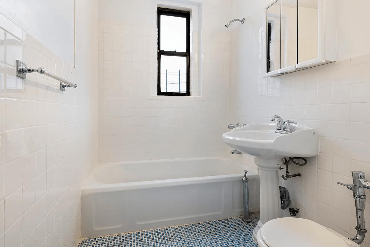 bathroom with blue tile floor