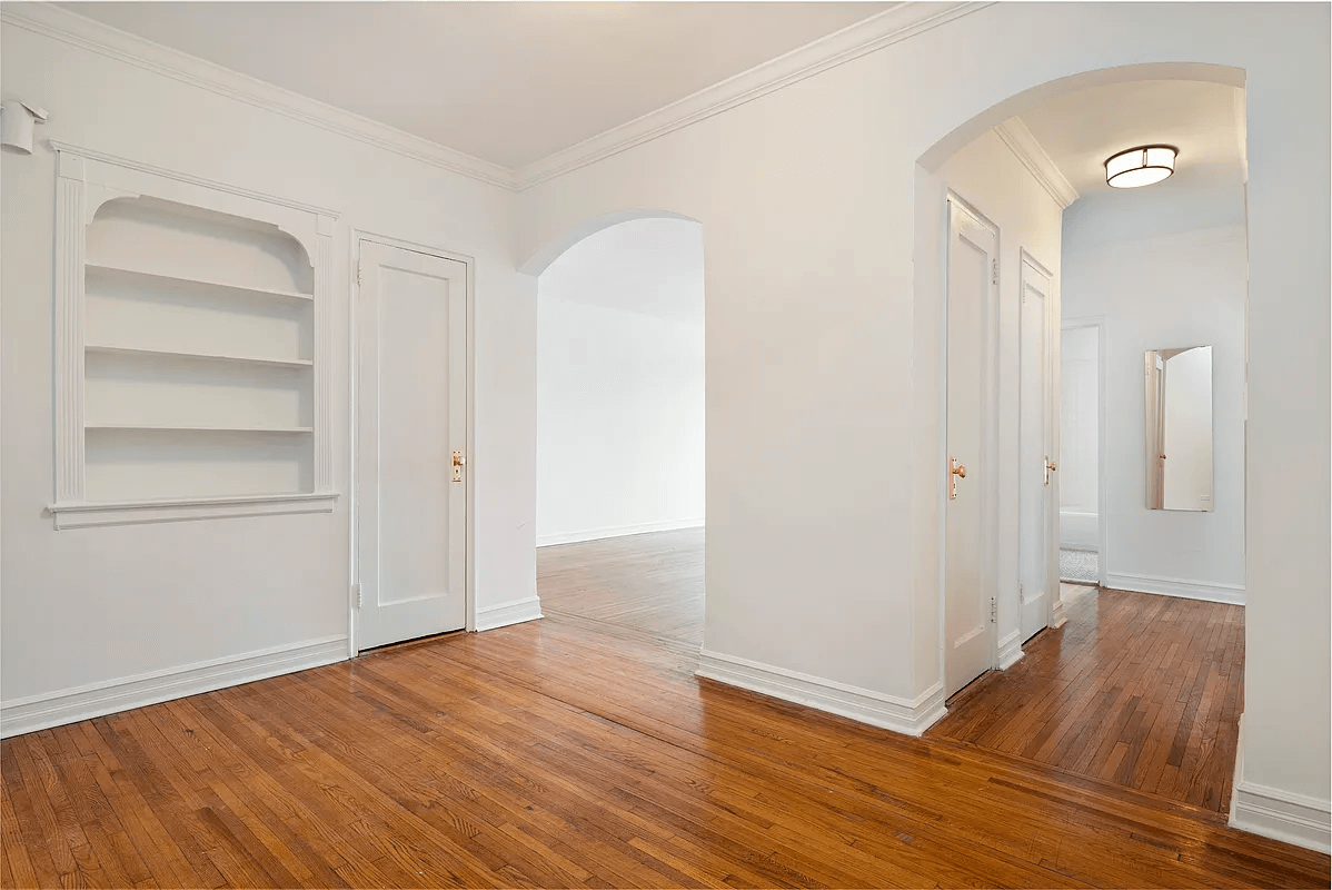 foyer with niche and arched doorways