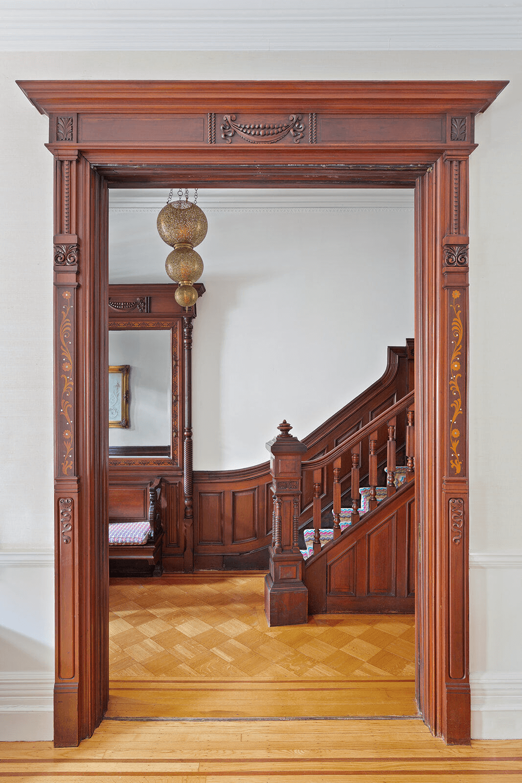 entry with pier mirror and original stair