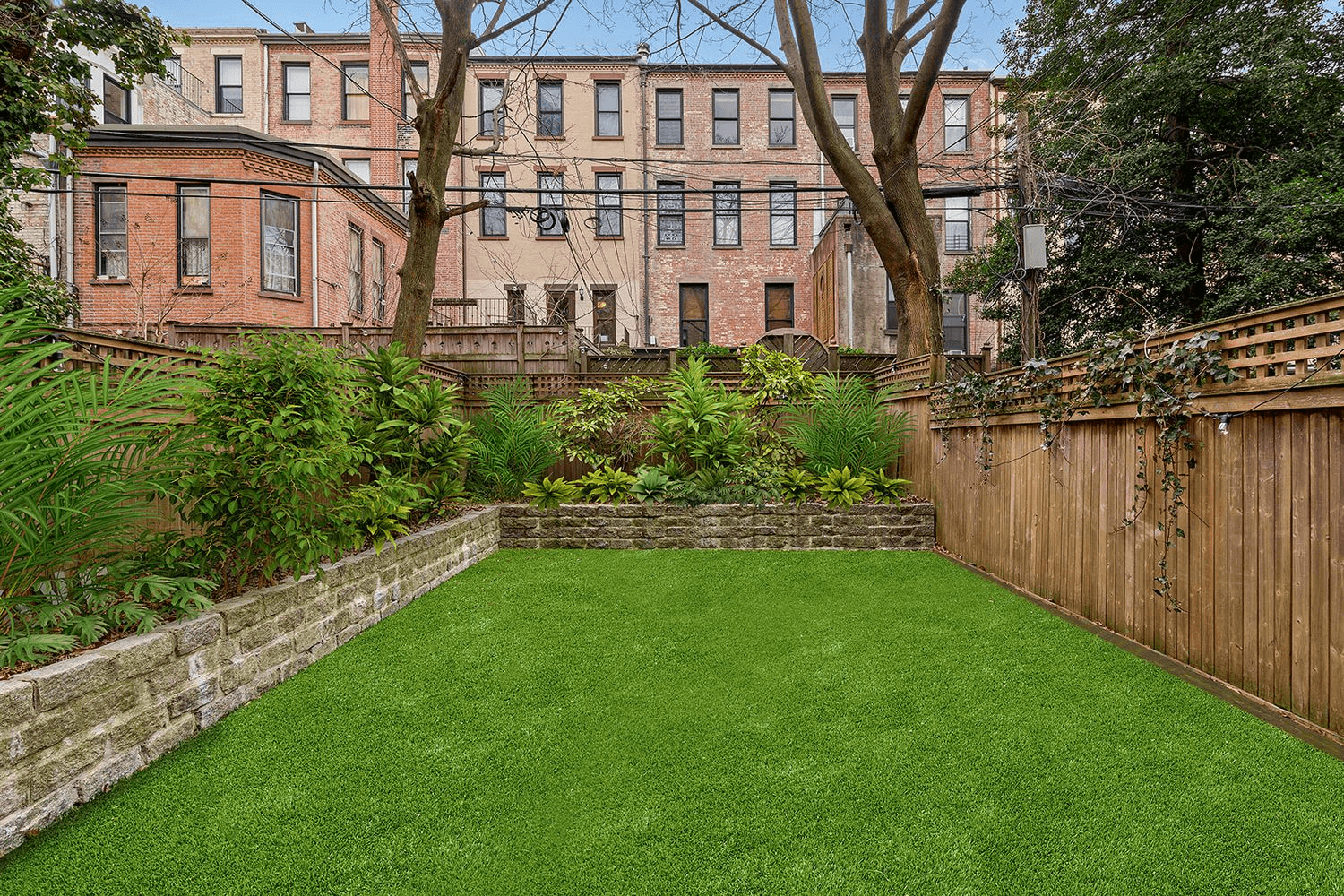 yard with fence and raised beds