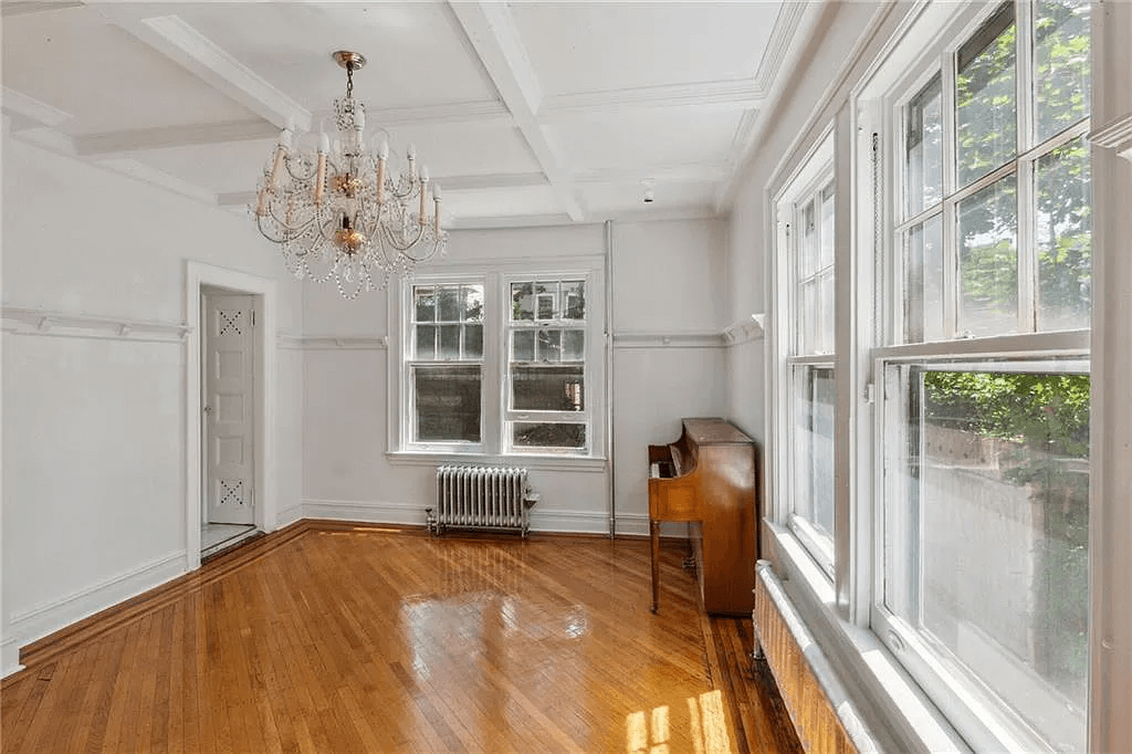 original dining room with beamed ceiling and plate shelf in 761 east 22nd street