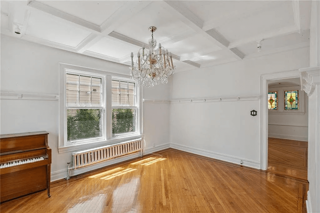 original dining room with beamed ceiling and plate shelf in 761 east 22nd street