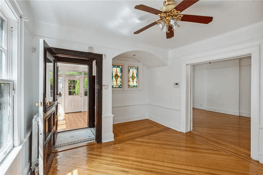 entry with stained glass windows in a nook in 761 east 22nd street