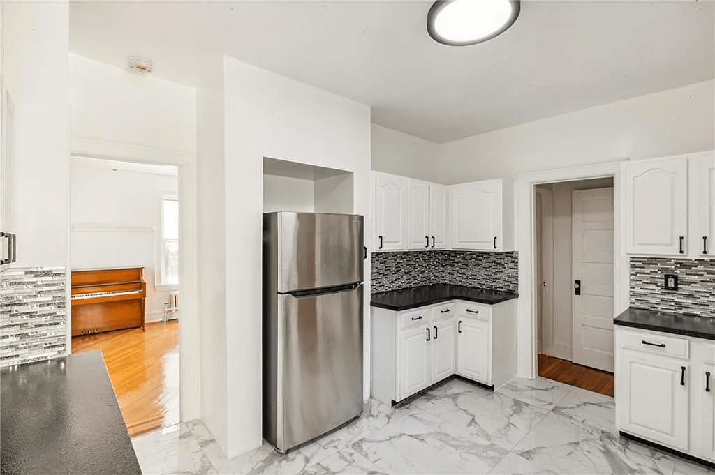 kitchen with white cabinets in 761 east 22nd street