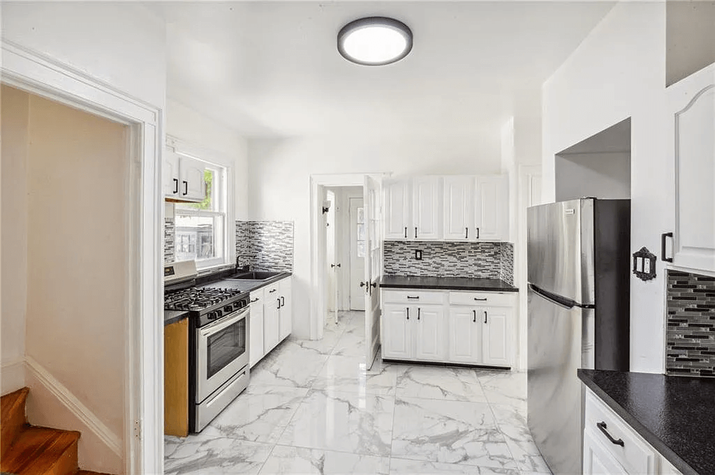 kitchen with white cabinets in 761 east 22nd street