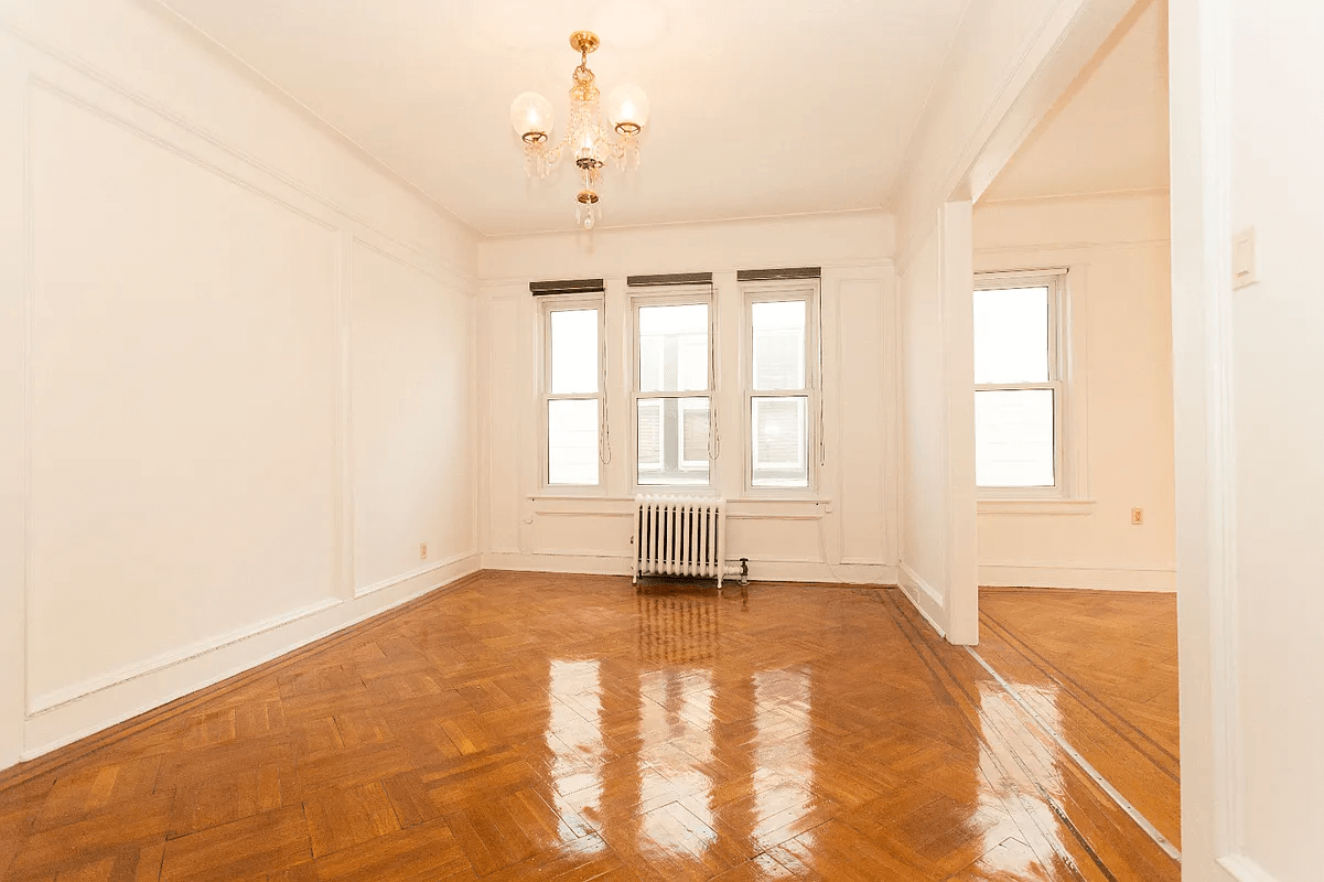 interior with three windows and wood floors