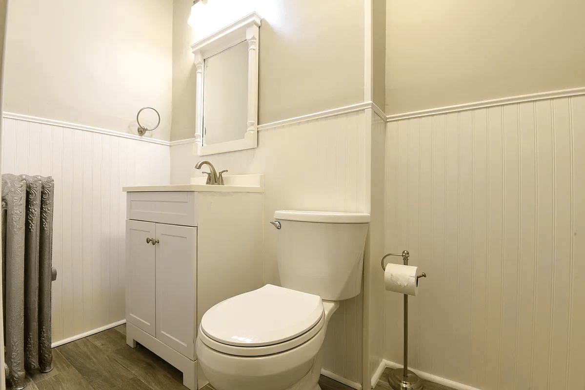 bath with beadboard and white fixtures
