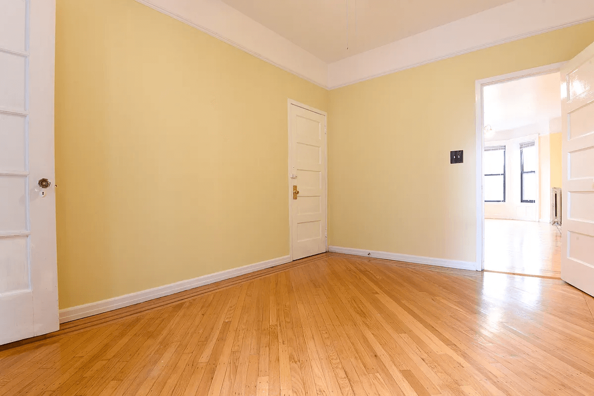 dining room with doors to living room, hall and kitchen