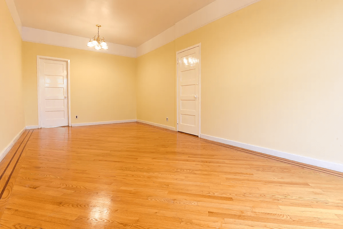 living room with picture rails and wood floor