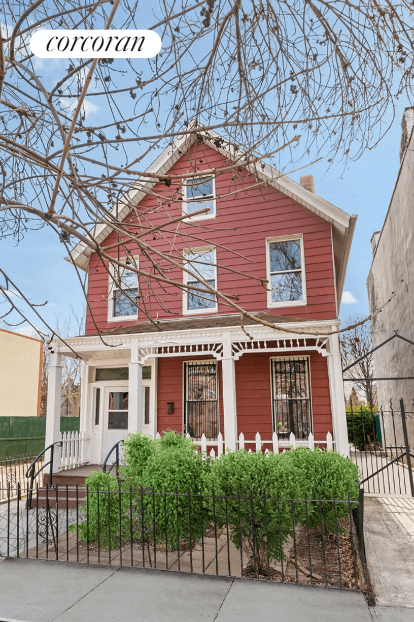 exerior of the red wood frame house